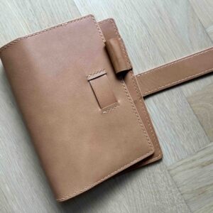 Travelers’ Personal notebook cover with belt closure