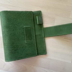 Pocket rings cover with chunky belt closure